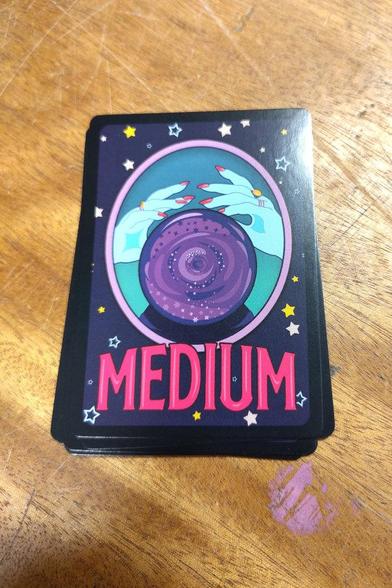 Deck of cards from the game Medium on a table top
