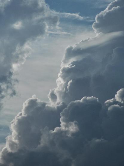 a close-up of three types of clouds from a fast brewing storm, taken somewhere in the afternoon