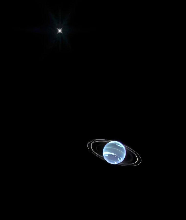 A processed view of the planet Neptune shining brightly in pale blue with two clear rings and it's moon Triton in a dark black sky
