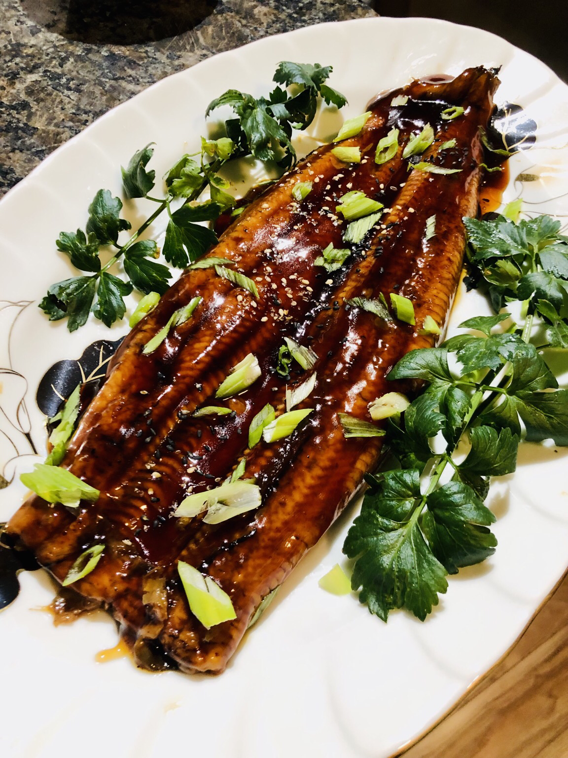 Teriyaki eel (store bought) i topped with green onion and parsley from my garden
