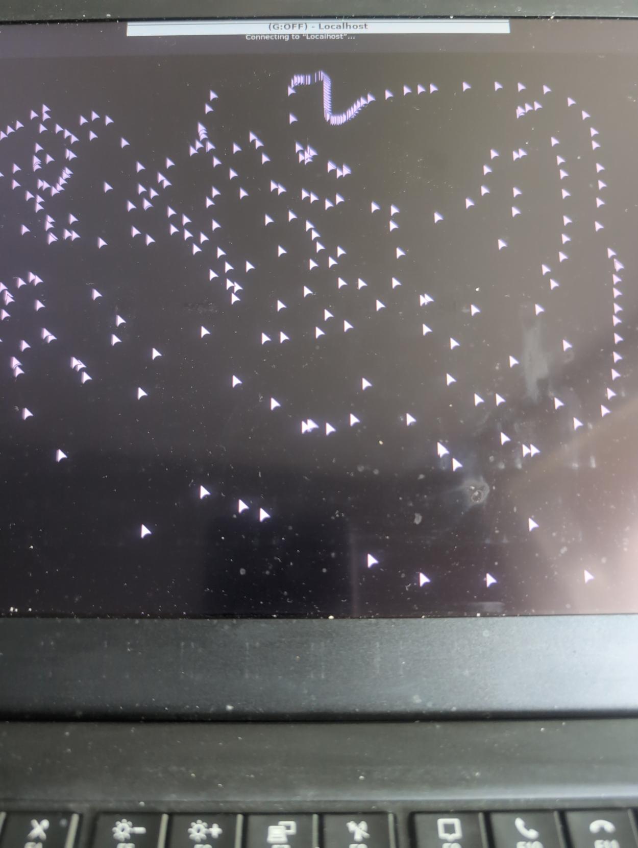 A picture of a laptop screen showing many mouse pointers all over the screen, vaguely reminiscent of Windows XP ghosting