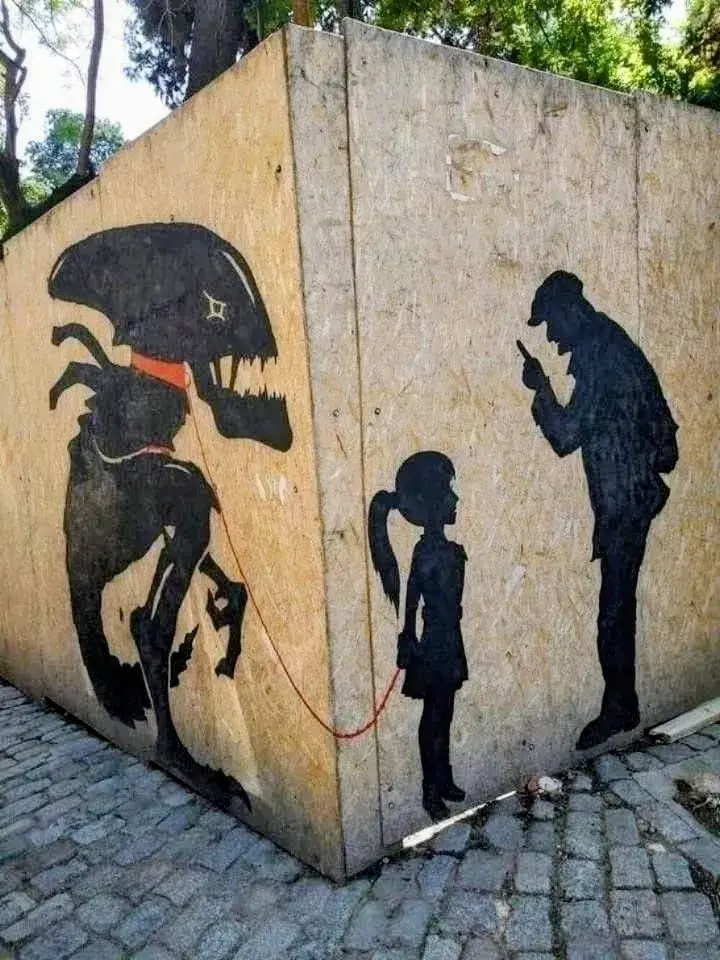 The mural features a young girl walking a pet Alien creature on a leash, confronting an elderly man pointing a finger.